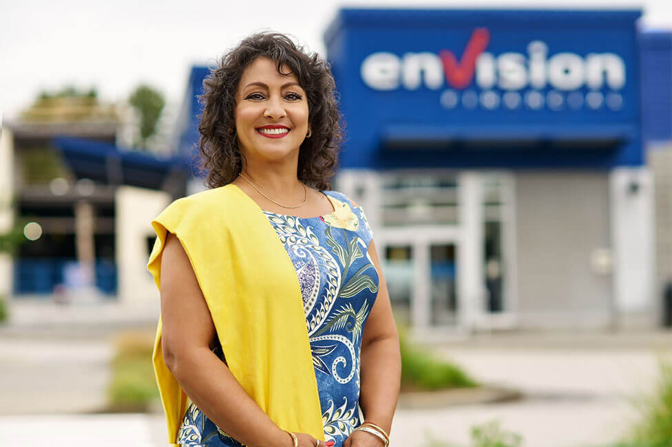 A woman standing outside of a bank branch