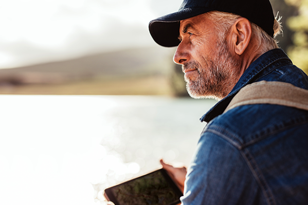 An older man staring out to nature