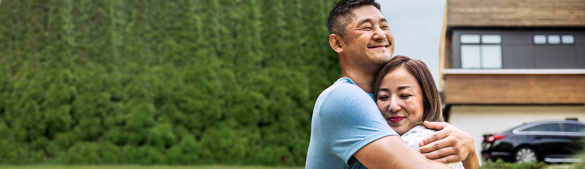middle-aged asian couple hugging