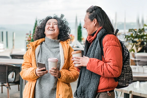 two friends chatting on a walk